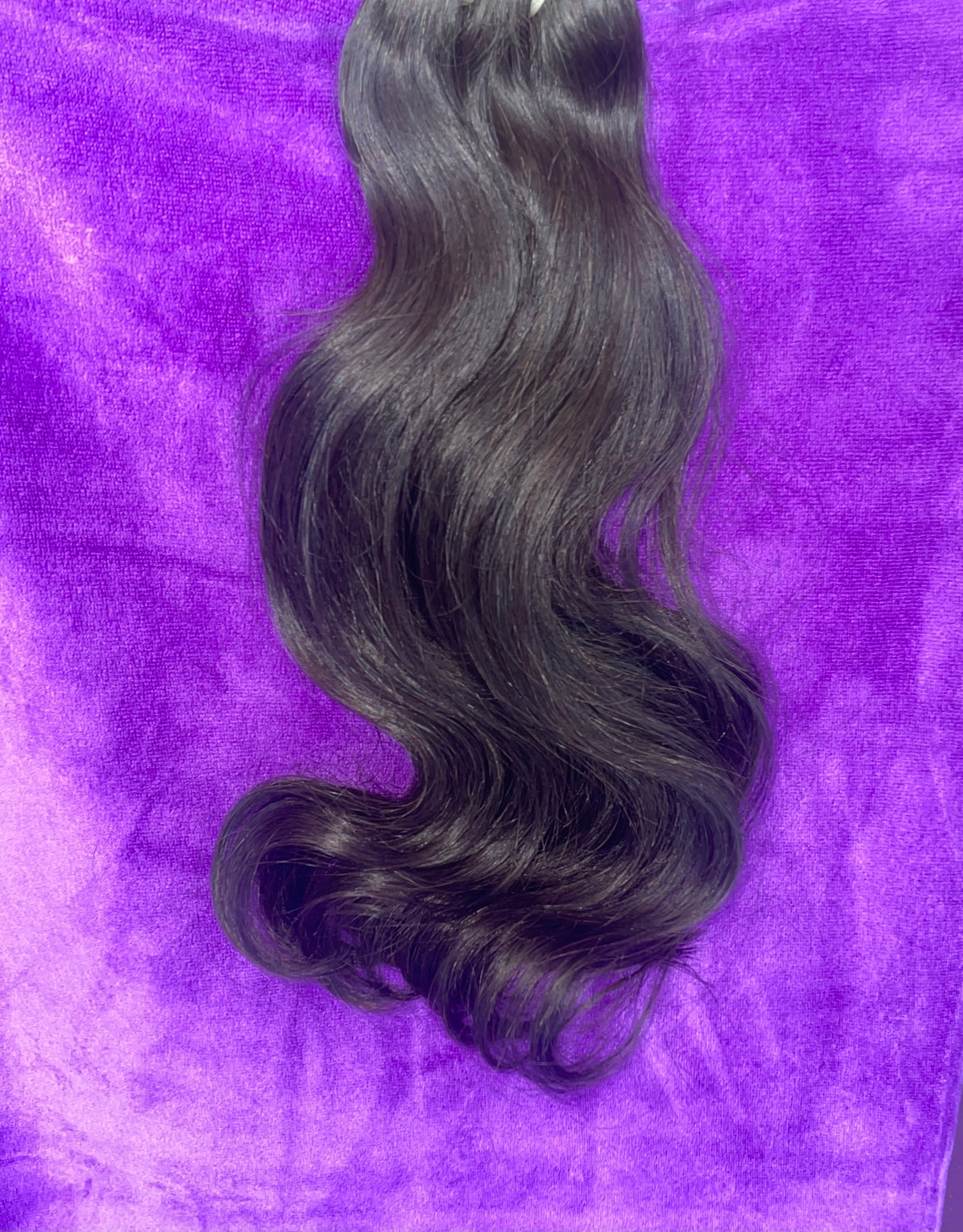 100% raw human hair extensions in OKC. Sof Wave texture natural black color